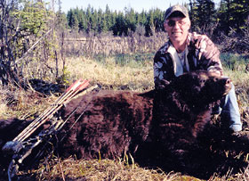 Outfitter, Allan Tew, with black bear measuring 19 8/16 Pope & Young 